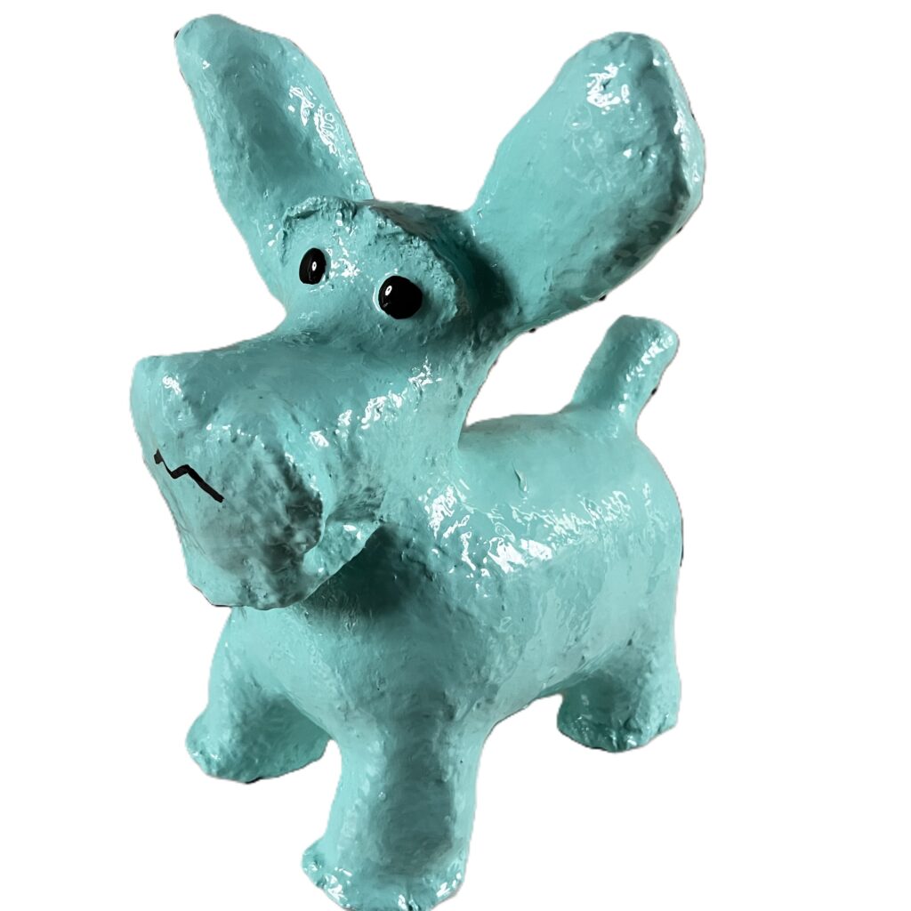 Blue sculpture of a schnauzer dog with an expressive face