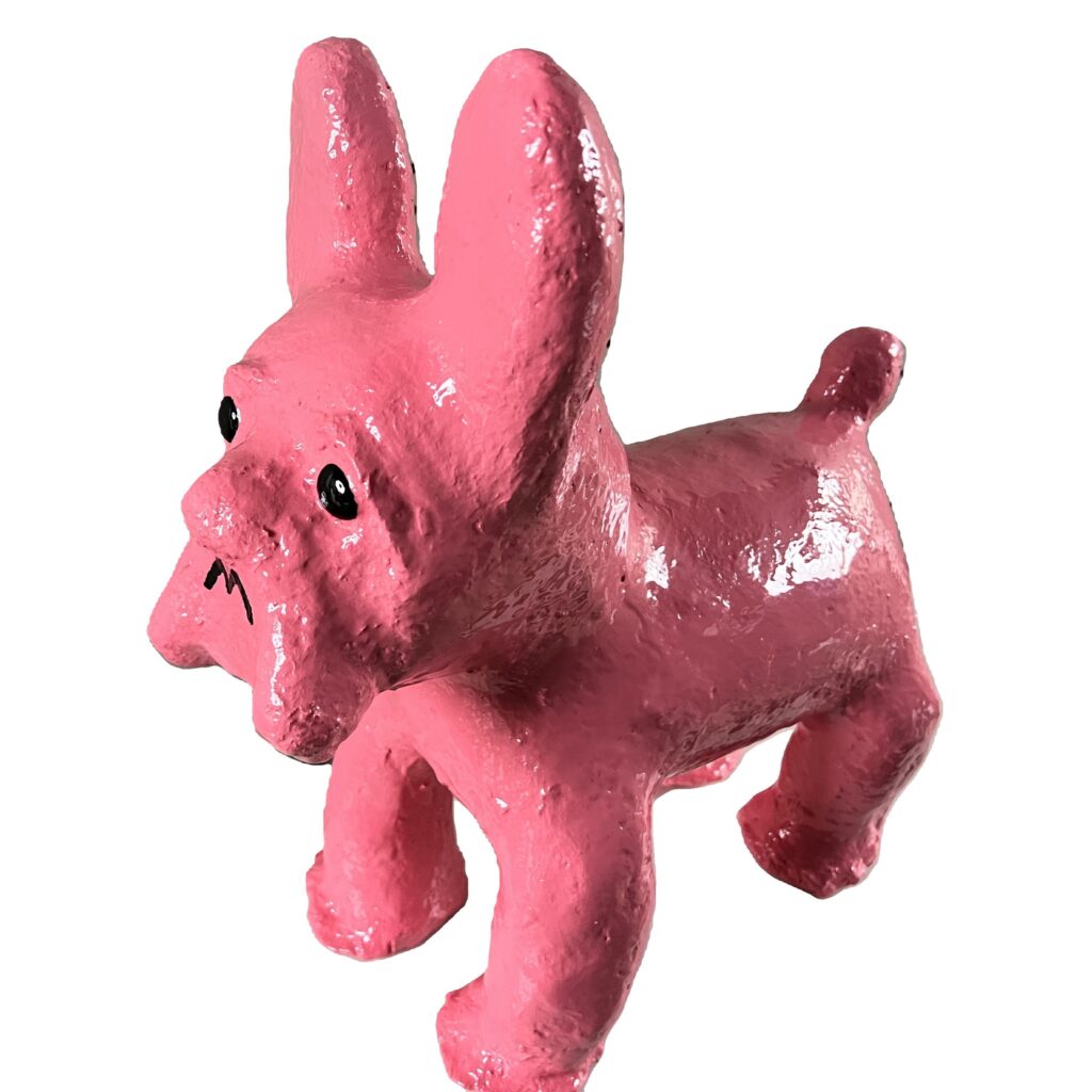 Bright pink dog figurine with expression