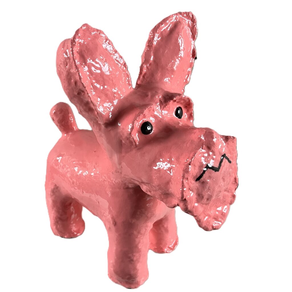 Pink dog sculpture with big ears